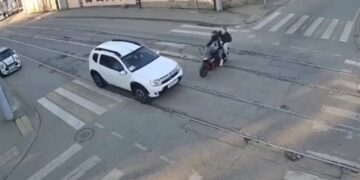 Horrific moment motorcycle smashes into car, killing rider and seriously wounding passenger