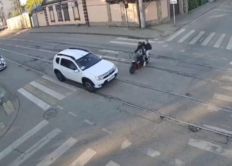 Horrific moment motorcycle smashes into car, killing rider and seriously wounding passenger