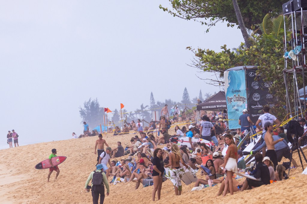 Beachgoers take over a beach in Oahu, Hawaii for the Lexus Pipe Challenger on Feb. 5, 2026.