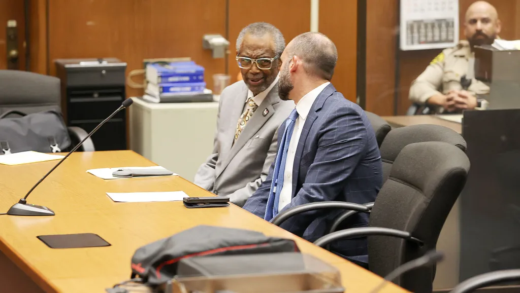 Curren De Mille Price Jr. and his attorney in Los Angeles Superior Court.