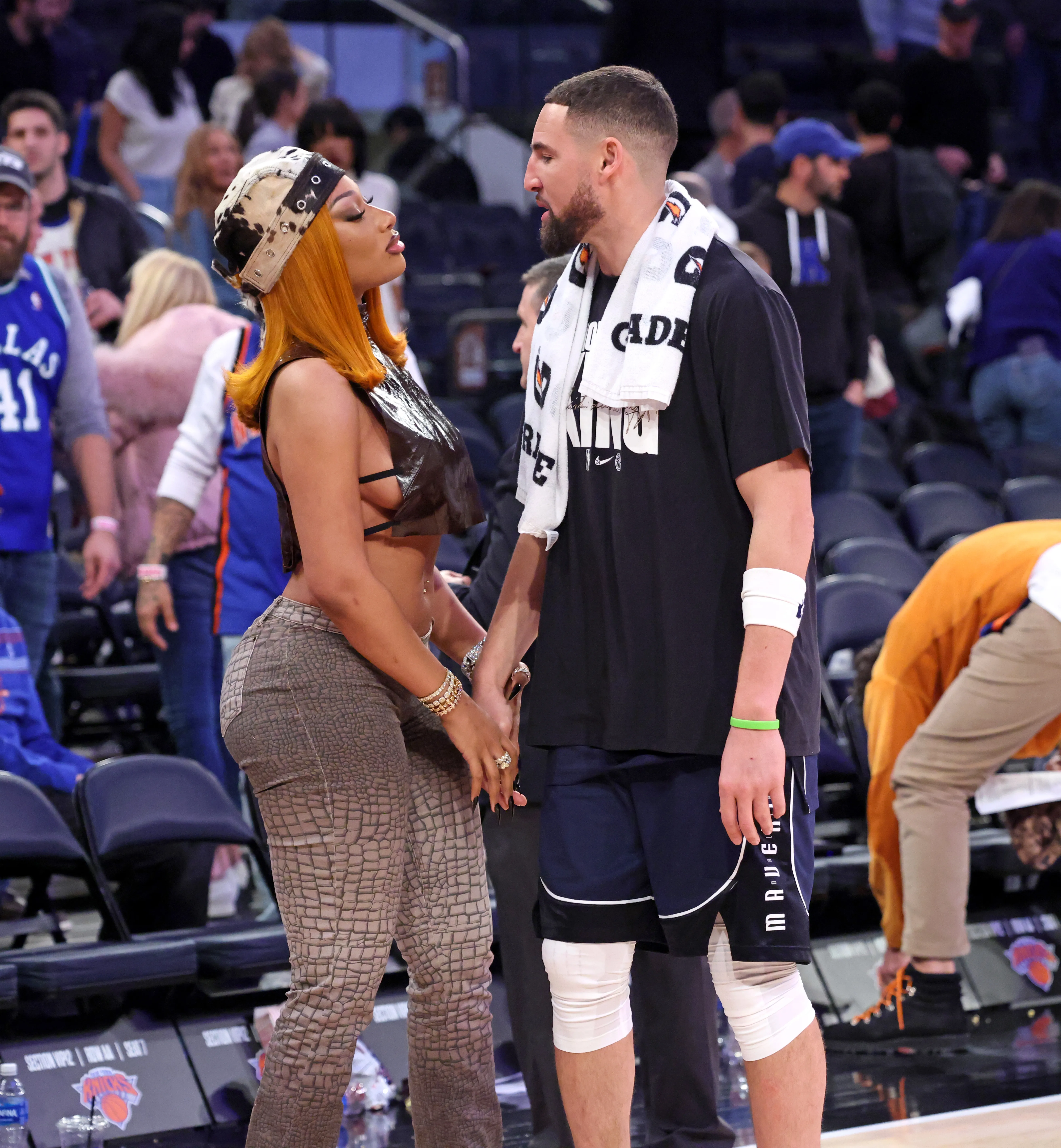 Music artist Megan Thee Stallion greets her boyfriend Dallas Mavericks guard Klay Thompson #31 at the end of the game.