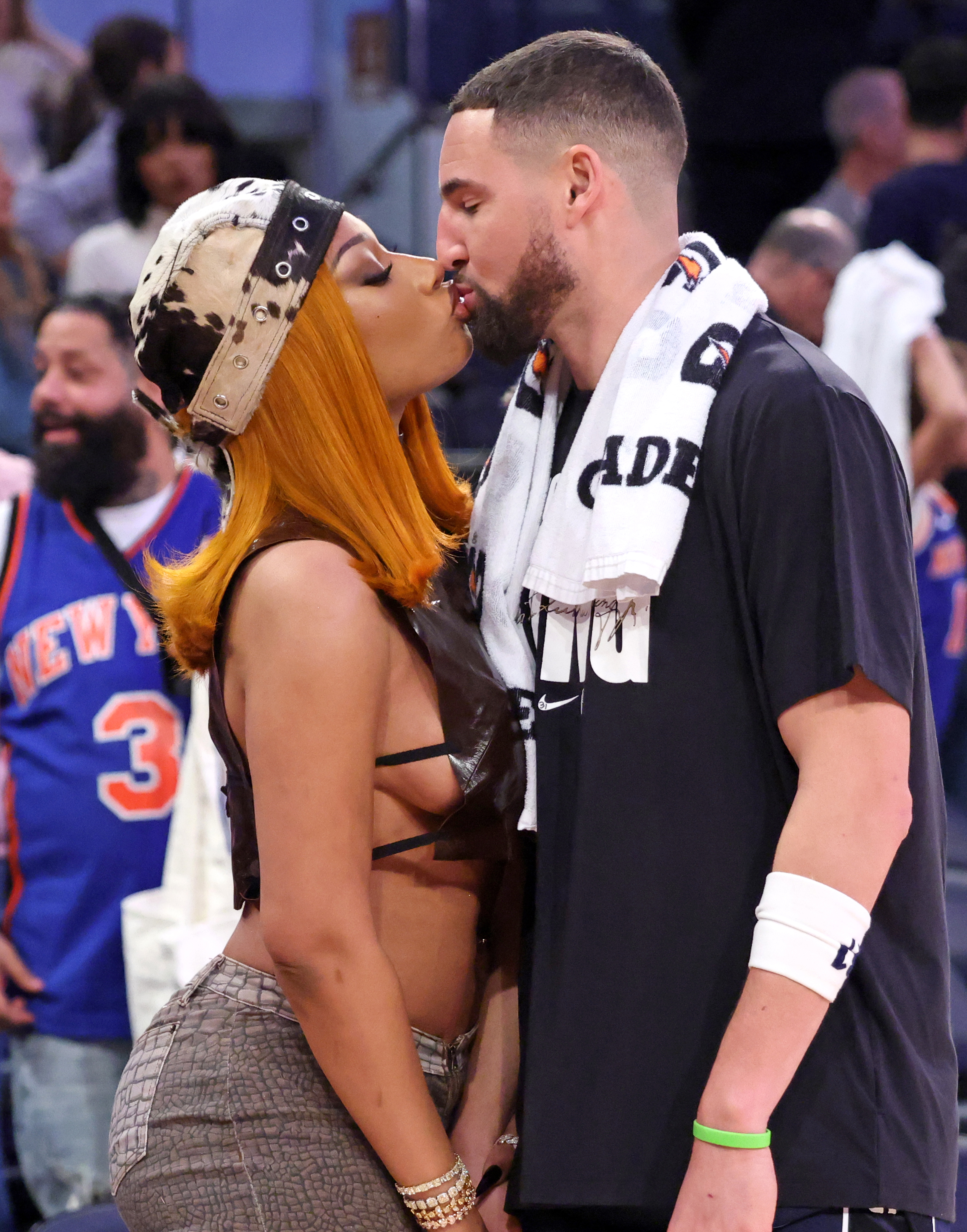 Megan Thee Stallion kissing Klay Thompson.
