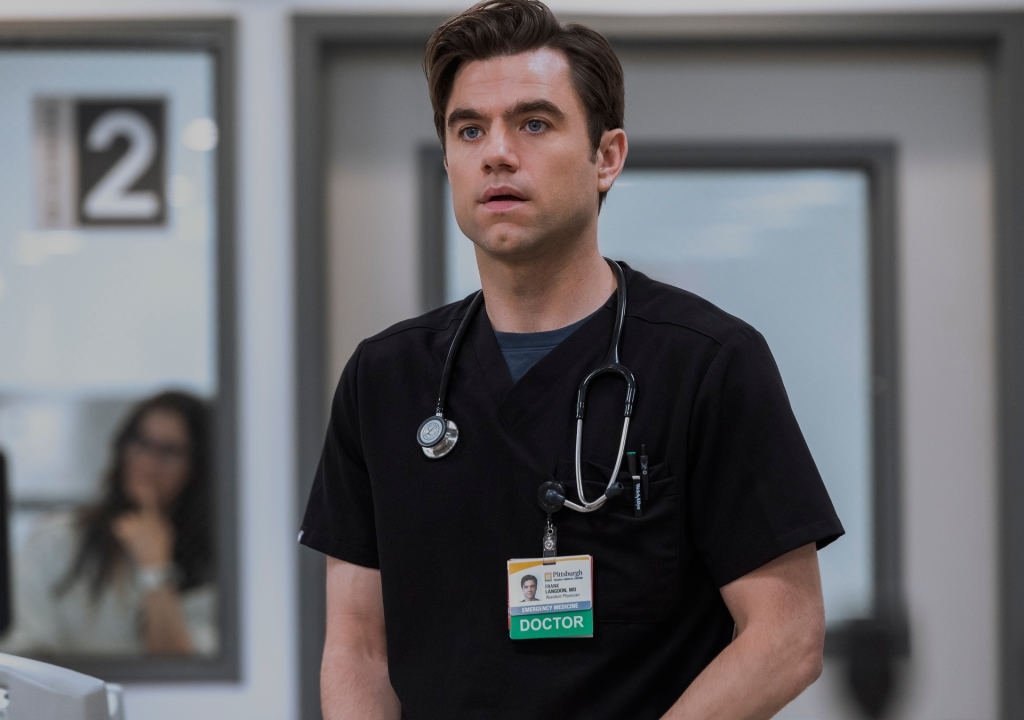 Doctor Langdon in scrubs with a stethoscope and ID badge.