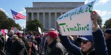 Red state city piles on charges for grandma arrested for crude costume at Trump protest