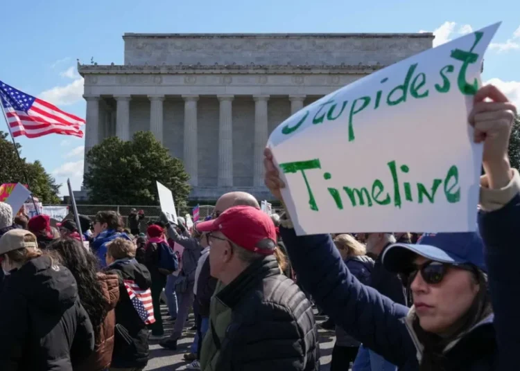 Red state city piles on charges for grandma arrested for crude costume at Trump protest