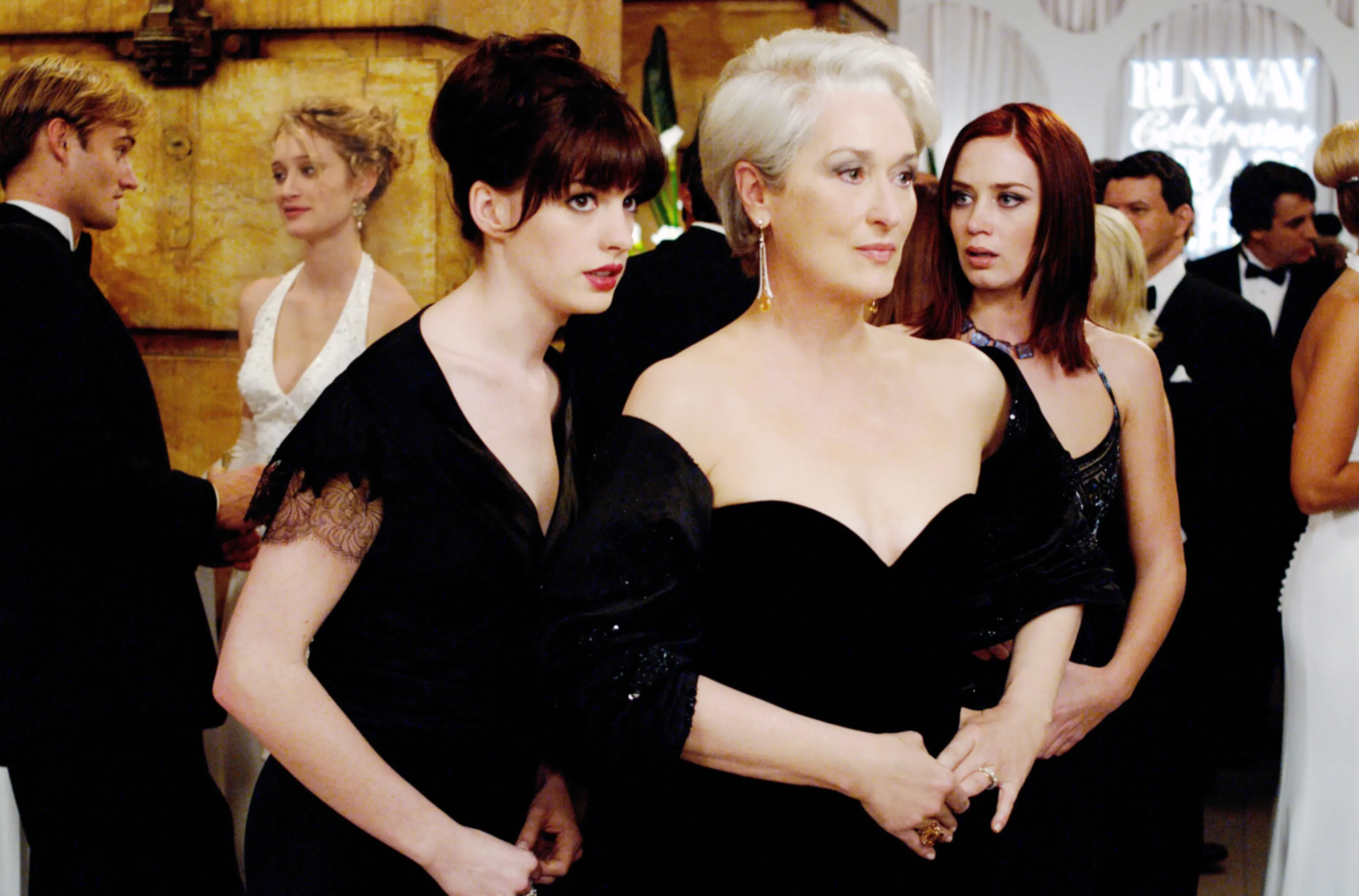 Meryl Streep as Miranda Priestly, Anne Hathaway as Andrea Sachs, and Emily Blunt as Emily Charlton in 