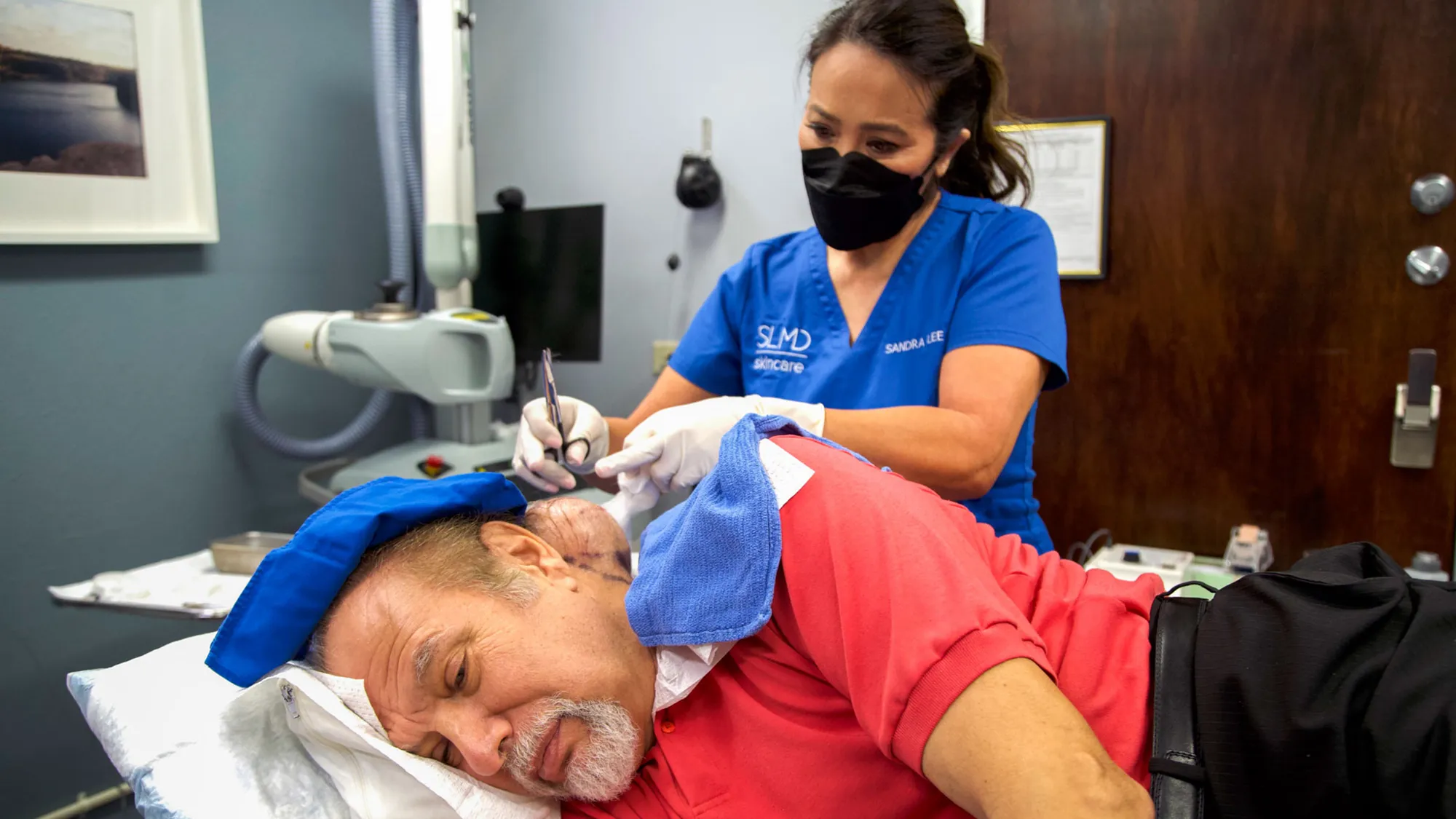 Dr. Sandra Lee performing surgery on Jess B.'s head lipoma.