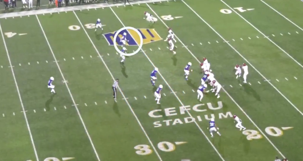 A San Jose State University football player in a blue and white uniform is circled on a green football field.
