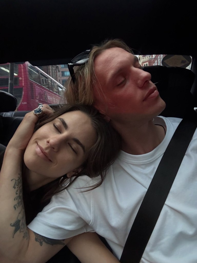 Elena Taber rests her head on her boyfriend Jamie Campbell Bower's shoulder in a car.