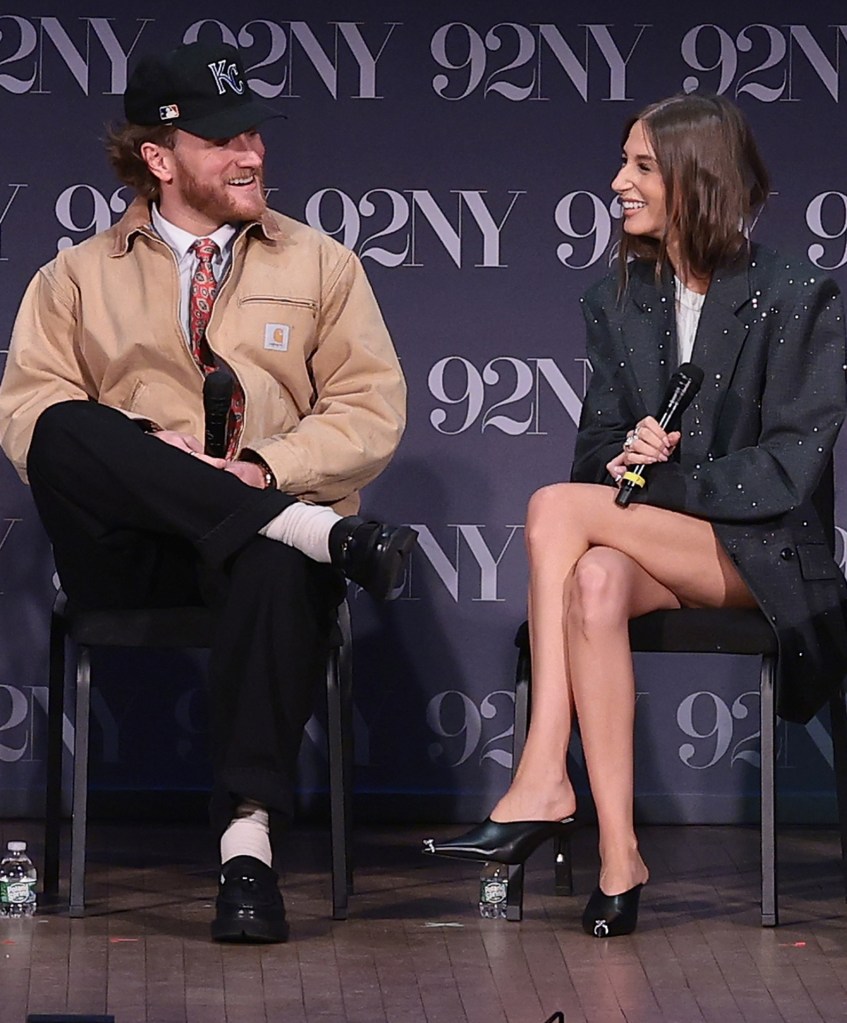 Emily Orozco and Jesse Solomon sitting and smiling at an event.