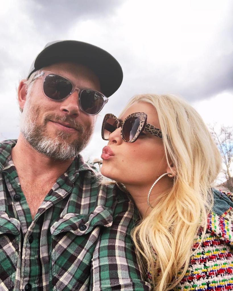 Eric Johnson and Jessica Simpson pose for a selfie, with Simpson making a kissing face.