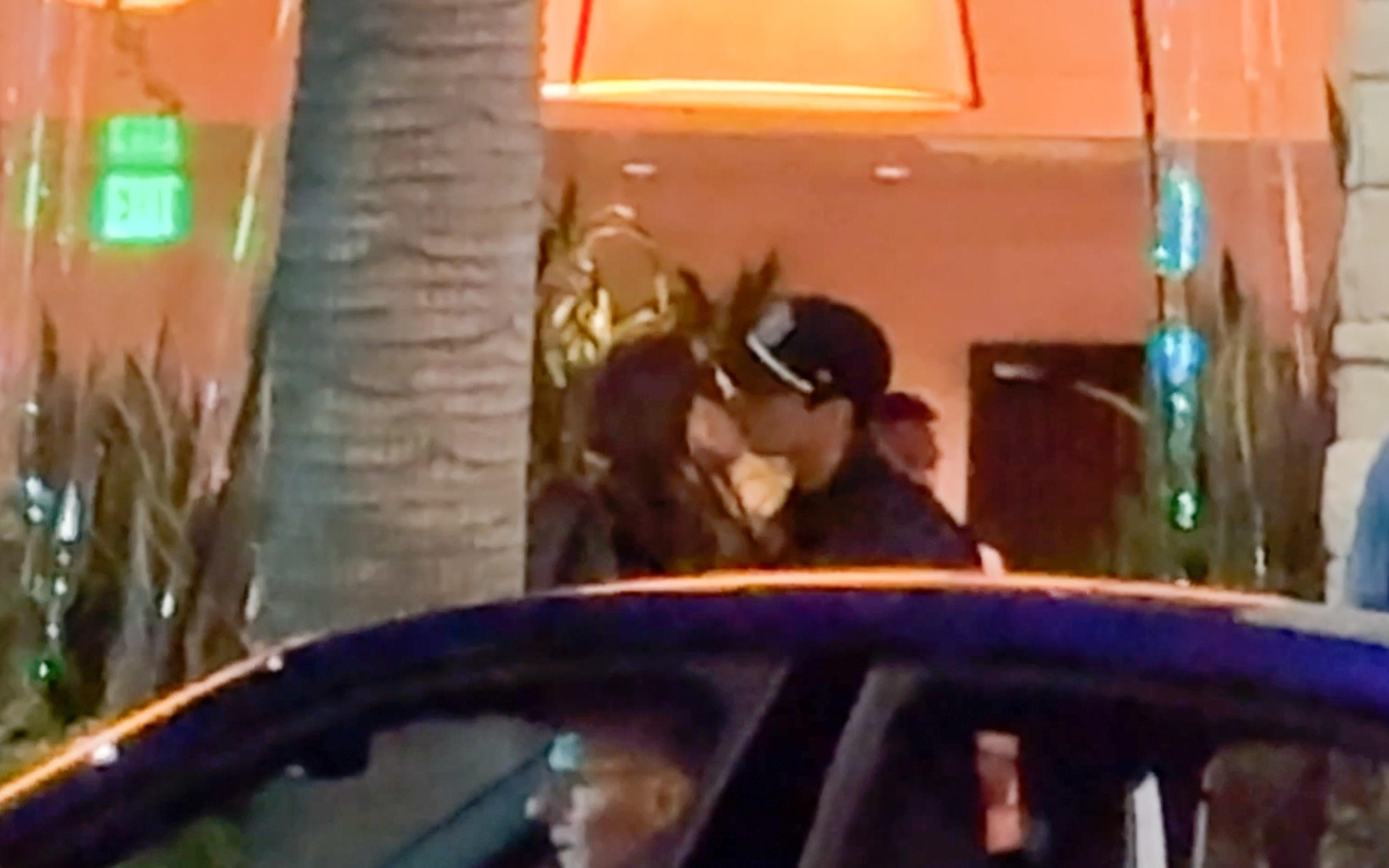 Jessica Alba and Danny Ramirez kissing outside Avra Restaurant in Beverly Hills.