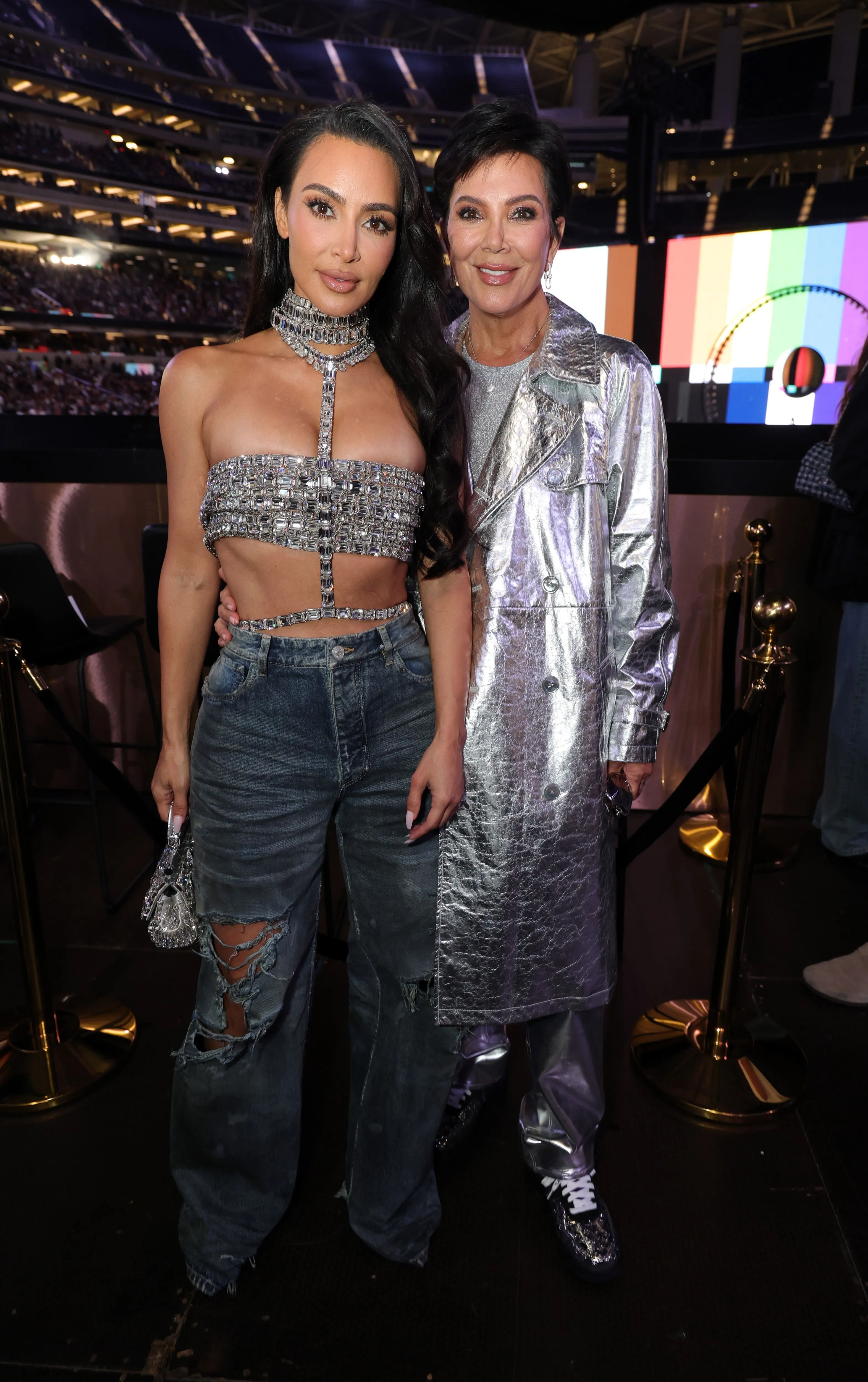 Kim Kardashian and Kris Jenner pose for a photo at SoFi Stadium.