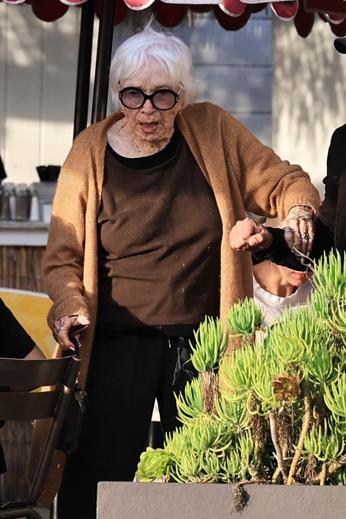 Shirley MacLaine being assisted while out for lunch in Malibu.