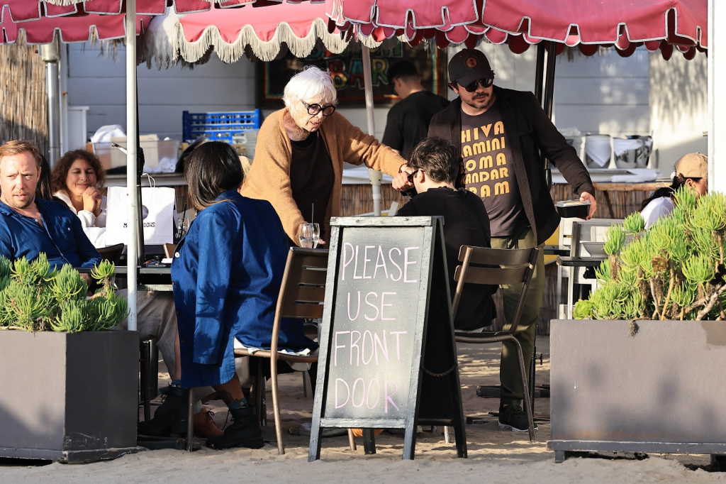 Shirley MacLaine being assisted for lunch in Malibu.
