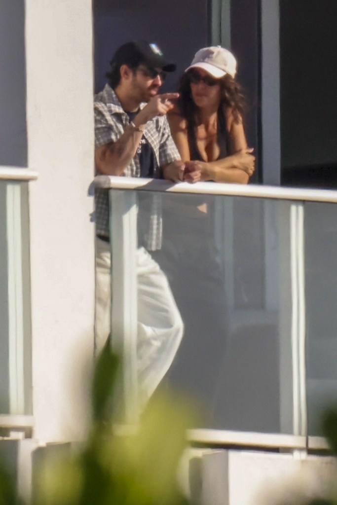 Joe Jonas and Tatiana Gabriela on a hotel balcony, taking in the Miami view.