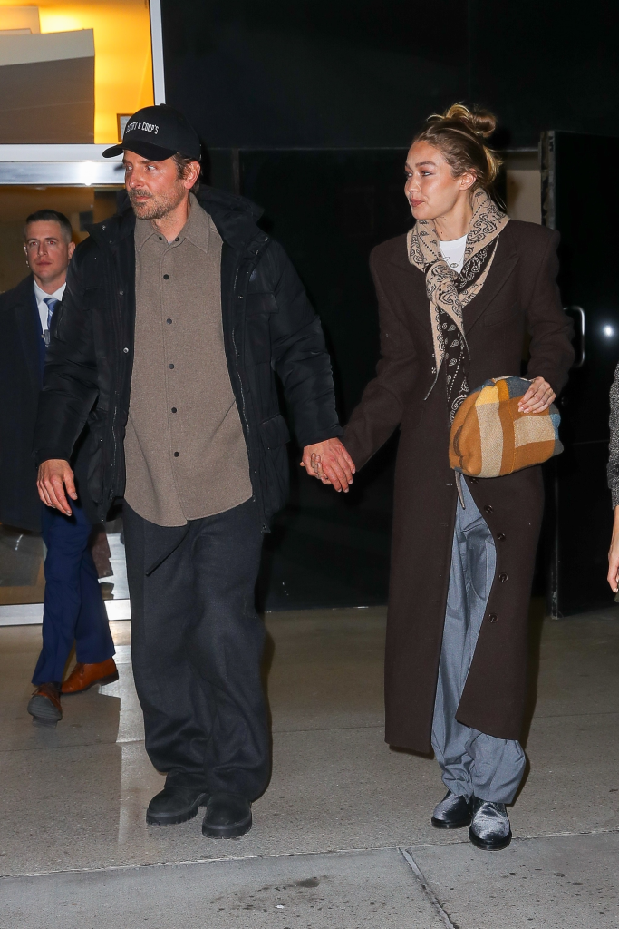 Bradley Cooper and Gigi Hadid holding hands while leaving the DGA Theater.