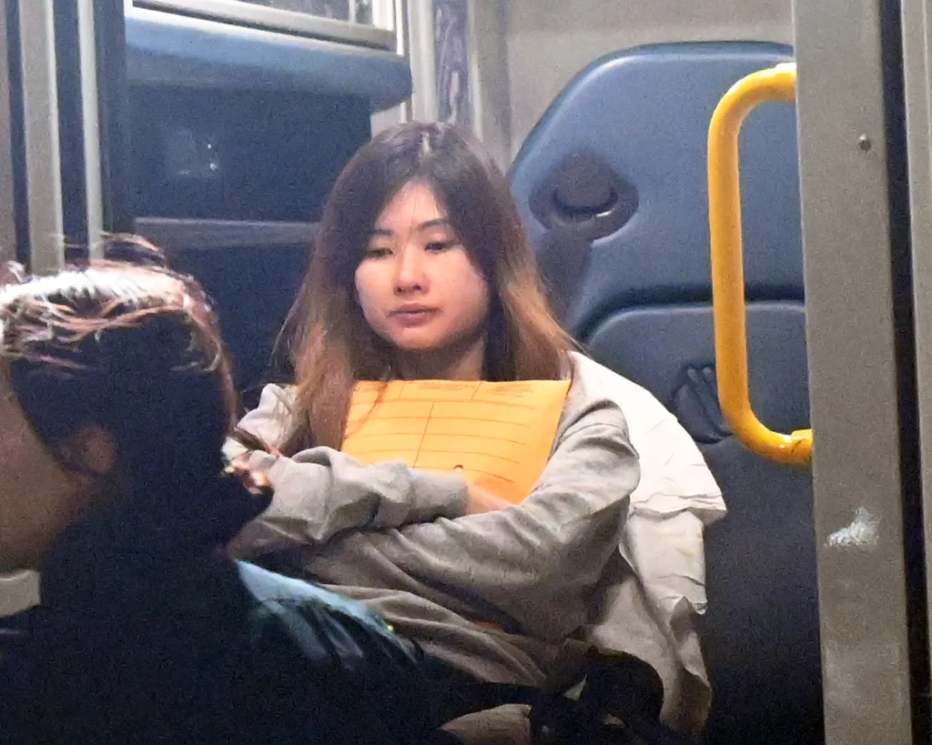 Pei Chung being taken away in an ambulance