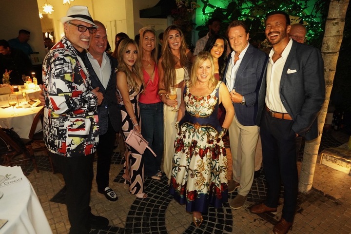 Andrea Bartzen surrounded by a group of people at an event.