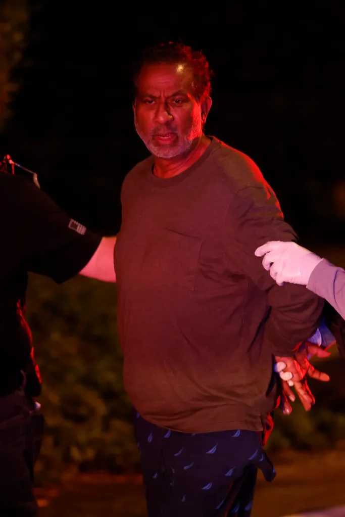 Gladwin Gill, who operates St. Francis Palliative Care in Anaheim, is apprehended by law enforcement agents.