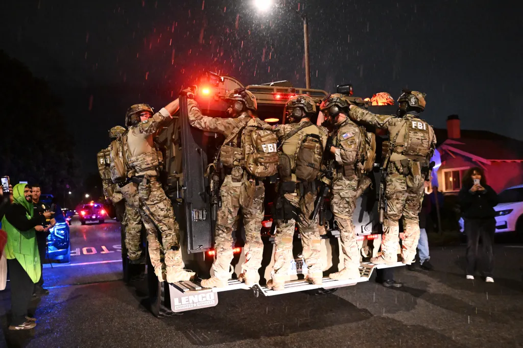 FBI officers leaving the scene after responding to an address connected to Cole Thomas Allen.