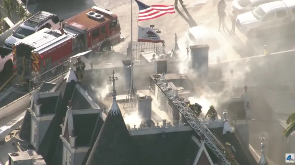Firefighters battle a fire on the roof of the Magic Castle in Hollywood.