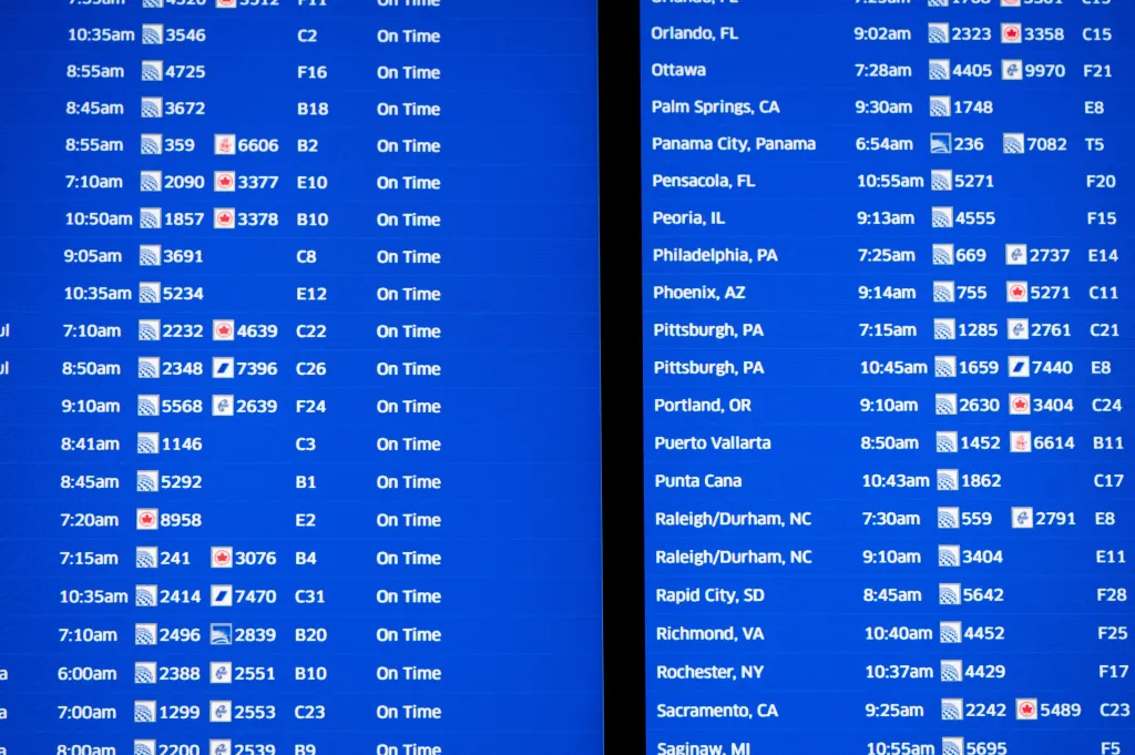 A flight board inside O'Hare International Airport during Thanksgiving week on Nov. 27, 2024.