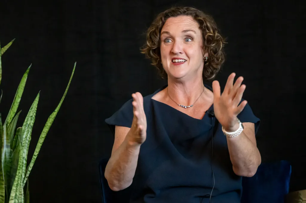 Katie Porter speaking at a gubernatorial candidates forum in Sacramento.