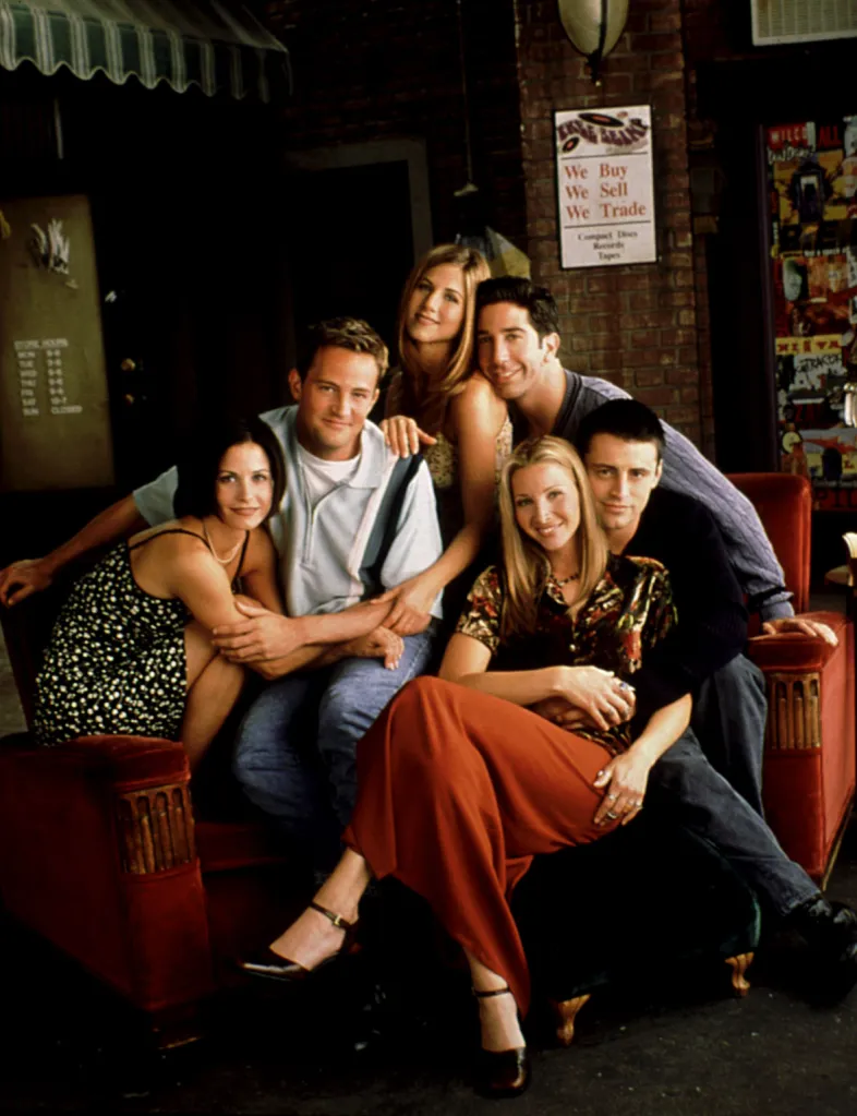 The cast of Friends, Courteney Cox, Matthew Perry, Jennifer Aniston, David Schwimmer, Lisa Kudrow, and Matt LeBlanc, pose together in a promotional shot.