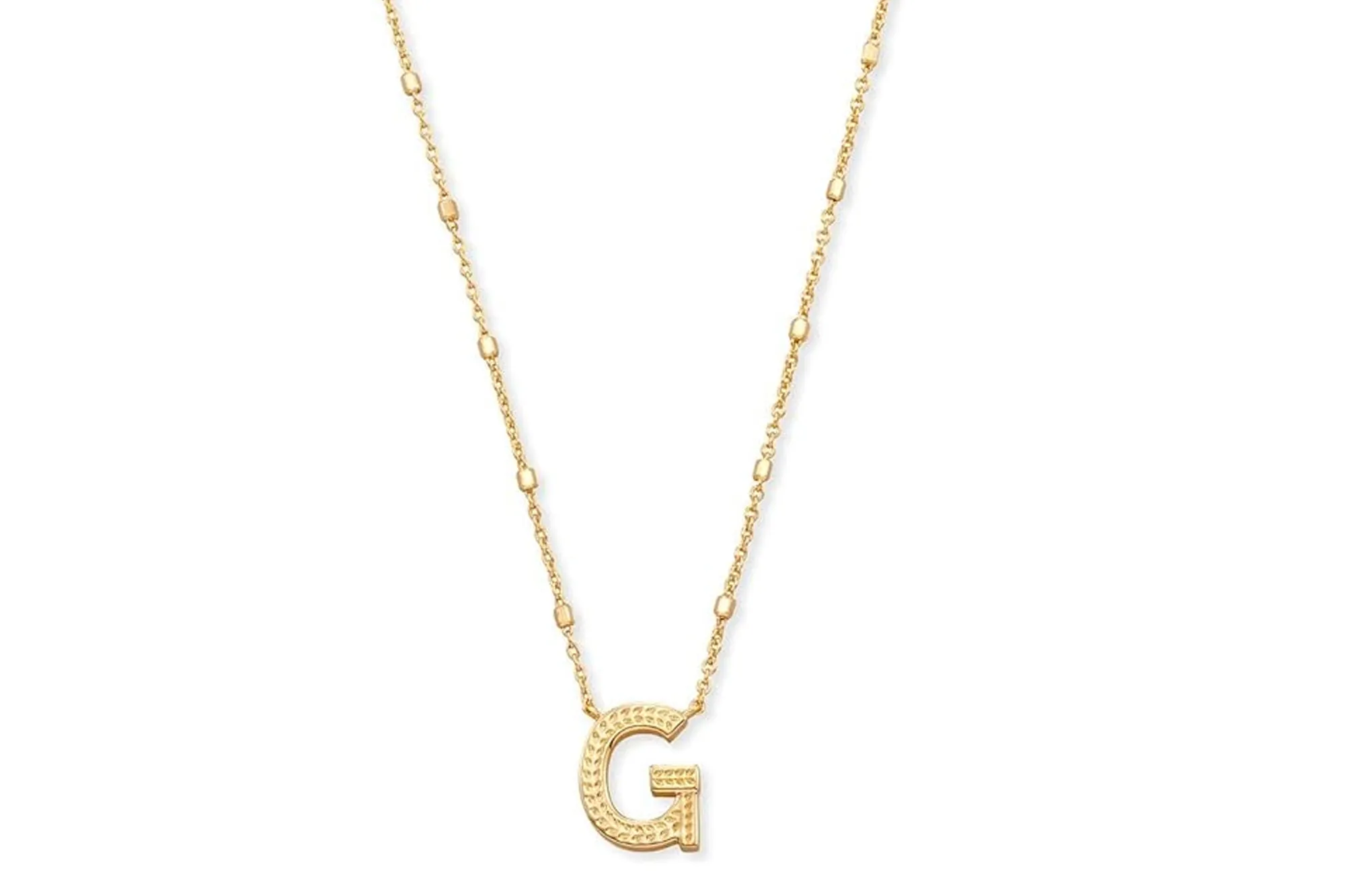 A gold G initial necklace