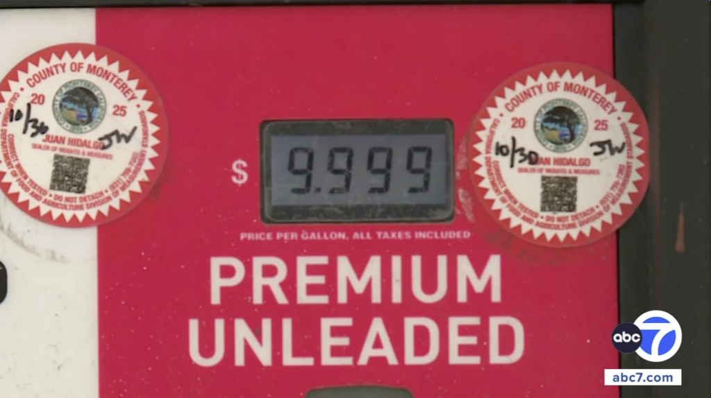 A gas pump showing $9.999 for Premium Unleaded gasoline.