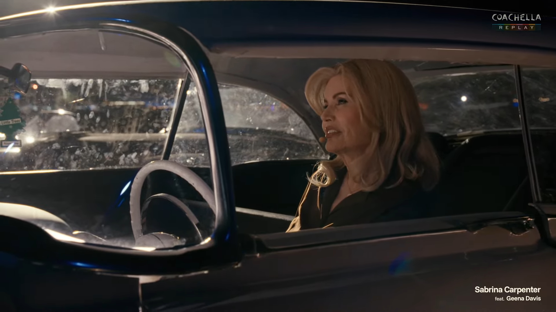 Geena Davis in a vintage car.