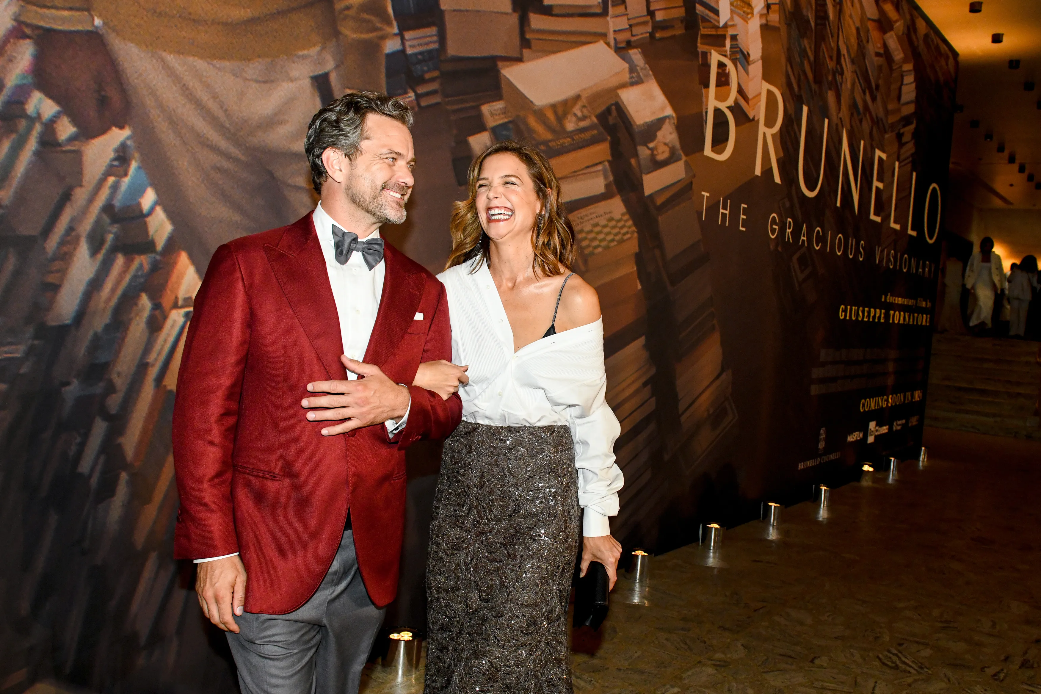 Joshua Jackson and Katie Holmes smiling at the Brunello Cucinelli gala screening of 