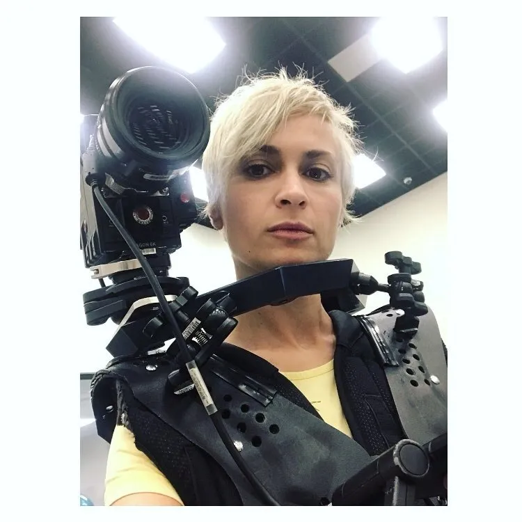 Cinematographer Halyna Hutchins wears camera equipment for a selfie.