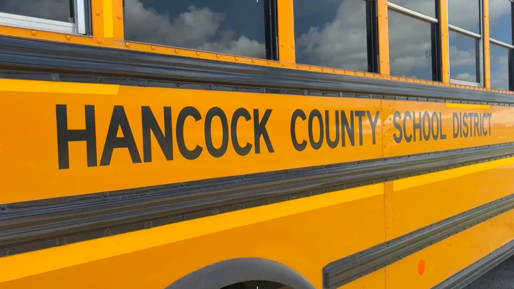 A yellow school bus that says Hancock County