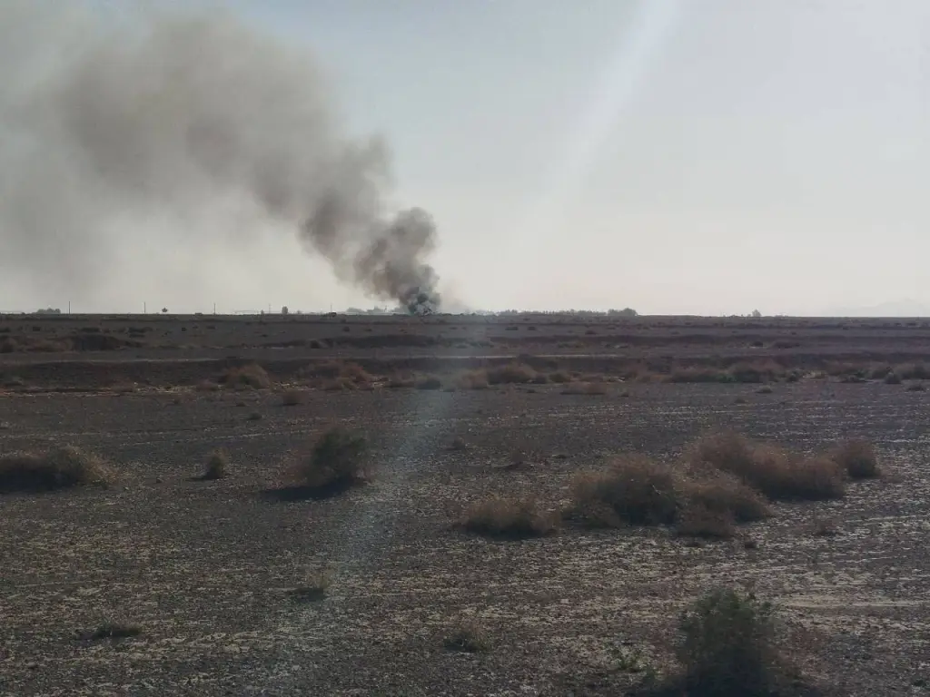 Smoke plume rising from the wreckage of a downed U.S. aircraft in Iran.