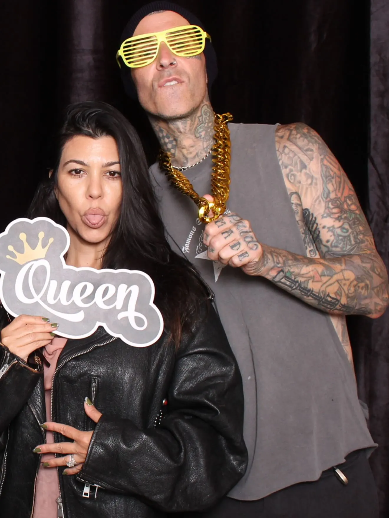 Kourtney Kardashian and Travis Barker posing for a photo.
