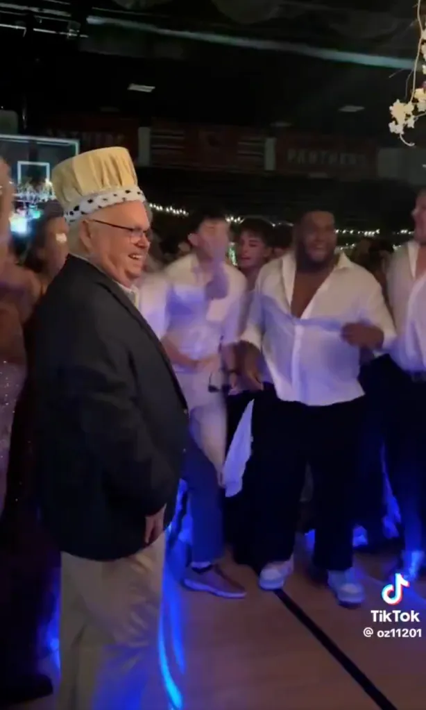 Kirk Moore, principal who took a bullet tackling a school shooter, crowned prom king.