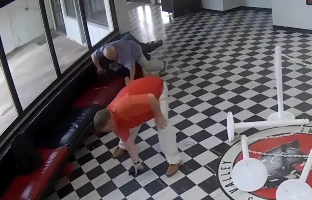 Principal Kirk Moore and other staff members tackling a school shooter.