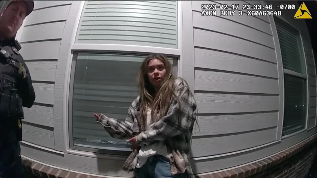 Body camera footage shows a police officer next to influencer Taylor Frankie Paul.