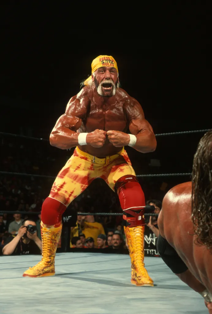 Hulk Hogan flexing in the wrestling ring during Backlash 2002.