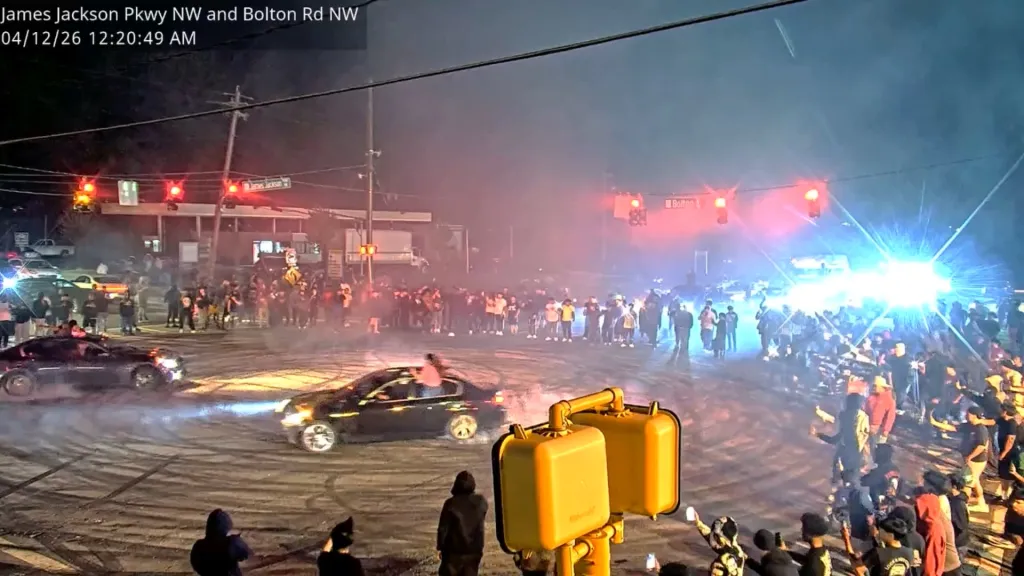 Hundreds of people swarm an Atlanta intersection to perform illegal street racing 