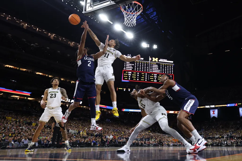 Roddy Gayle Jr. of Michigan blocks a shot by Silas Demary Jr. of UConn during the National Championship.