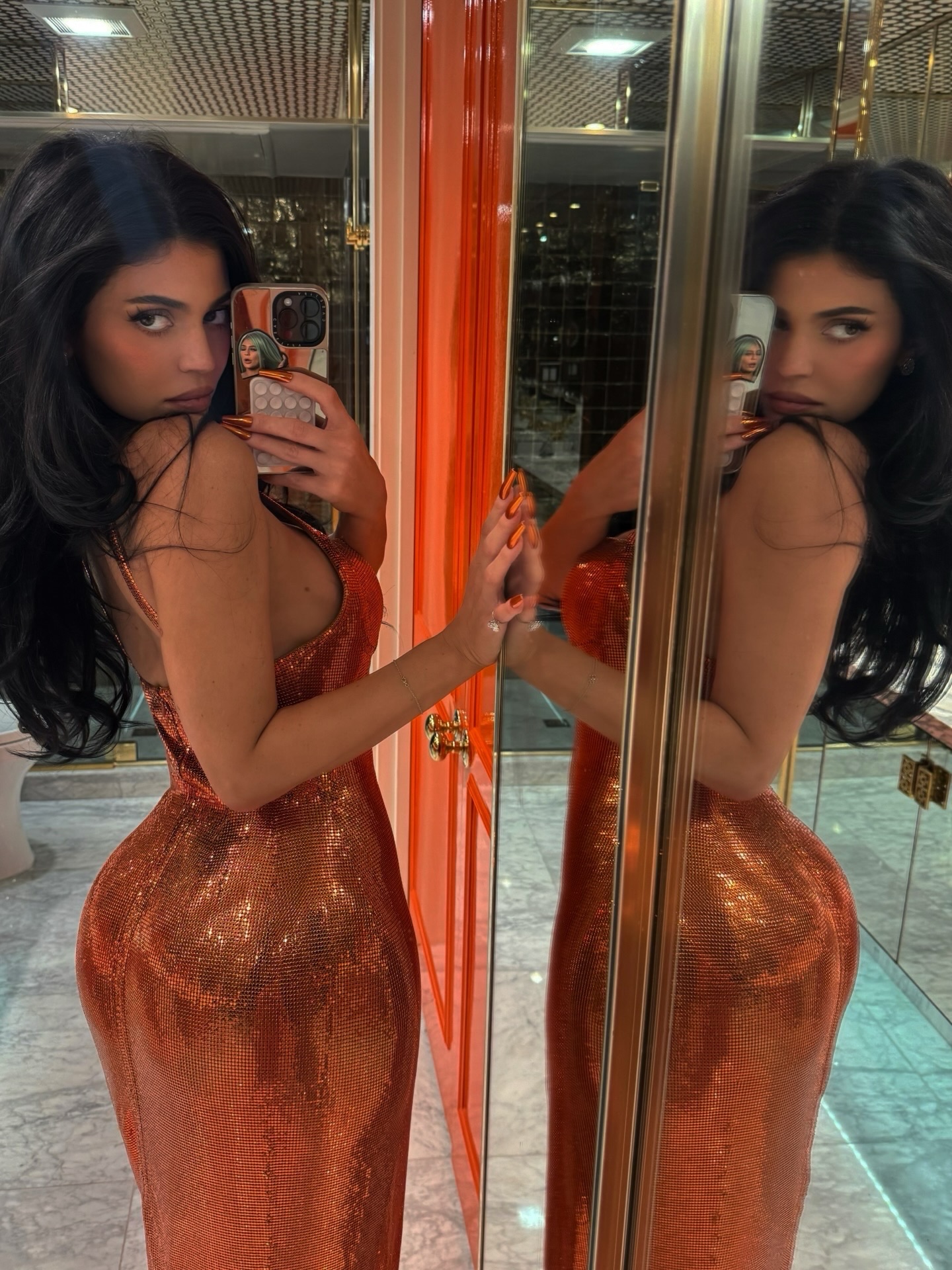 Kylie Jenner flaunts a massive diamond ring while taking a mirror selfie.