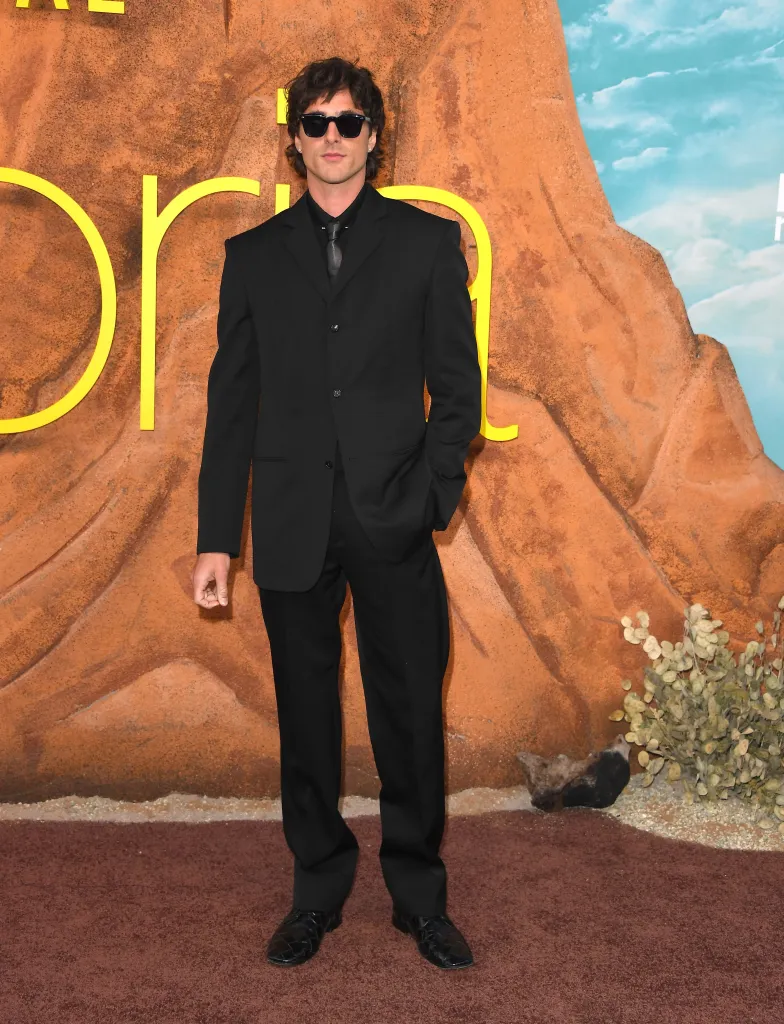 Jacob Elordi in a black suit and sunglasses at the