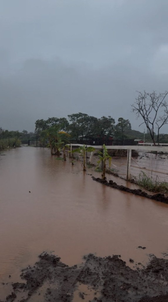 Floodwaters surround a house in Oahu, Hawaii, on April 10, 2026.