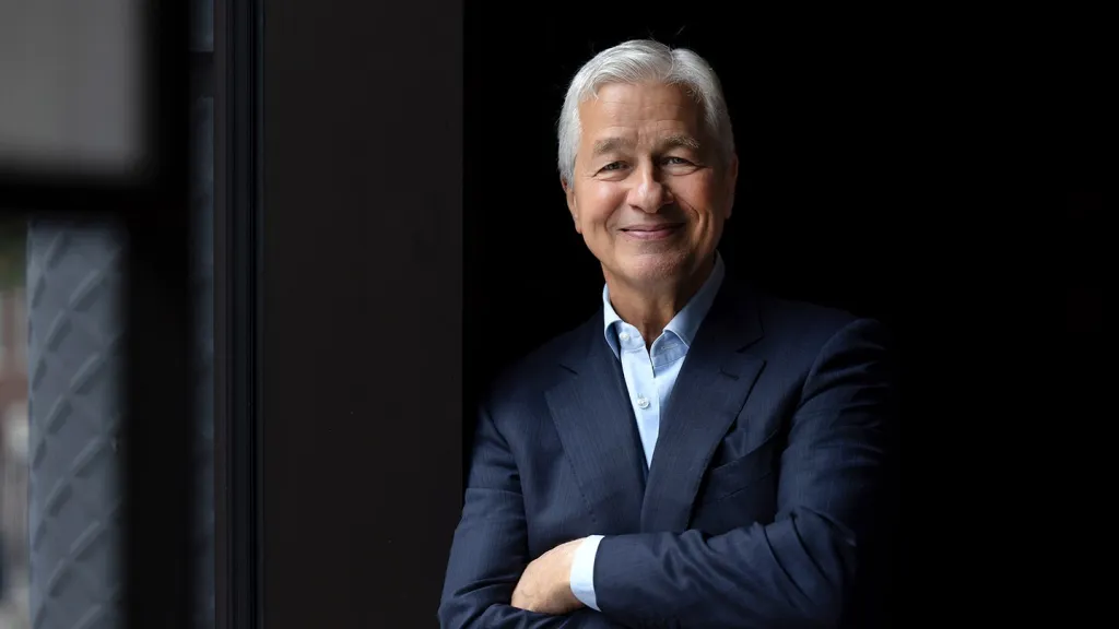 Jamie Dimon, JPMorgan Chase Chairman and CEO, smiling with his arms crossed.