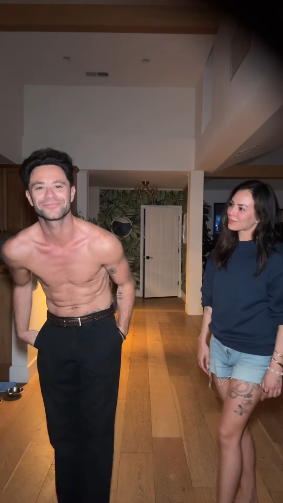 Janel Parrish and Sasha Farber in a house.