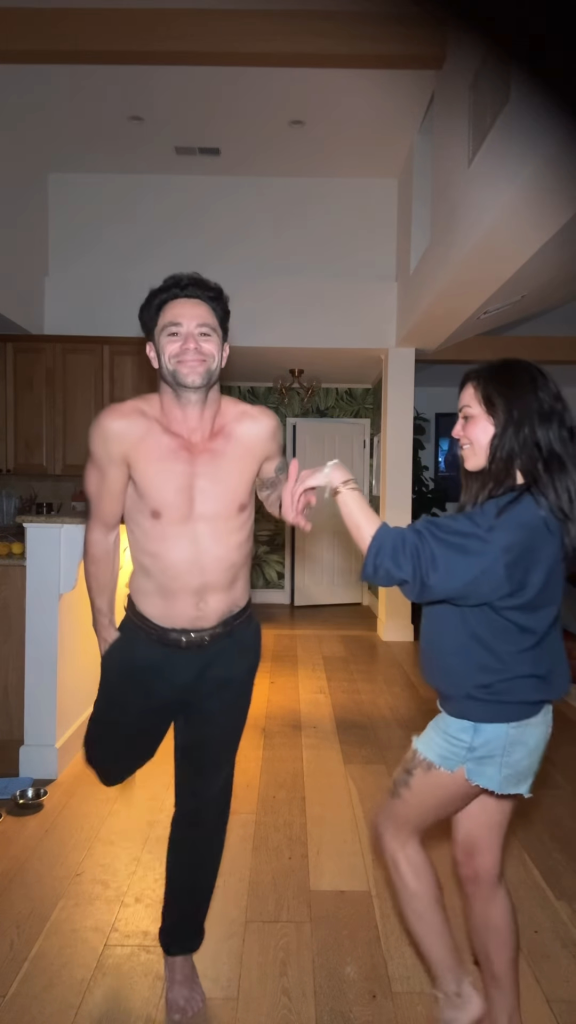 Janel Parrish and Sasha Farber dancing together.