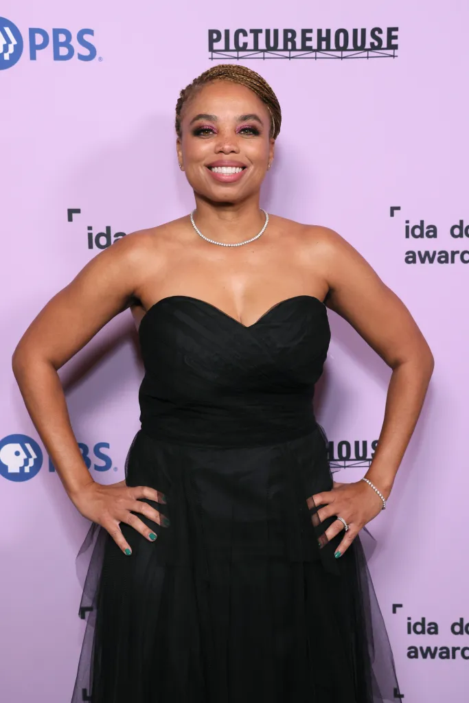 Jemele Hill attends The 40th IDA Documentary Awards in a black strapless gown and diamond jewelry.